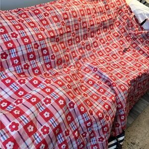 A polyester picnic table cloth. Plastic material for easy clean.